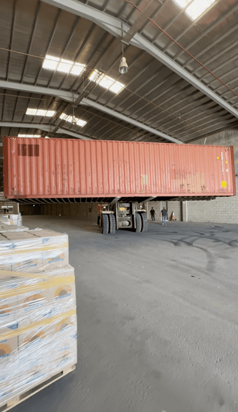 Forklift loading cargo at Safe Hands